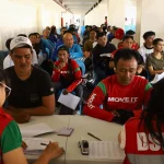 DSWD photo: Shows riders receiving cash aid