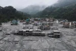 A drone view shows houses covered in mud after the flash floods and mudslide, at Devighat, Nuwakot district, Nepal, August 29, 2026. REUTERS/Francis Mascarenhas