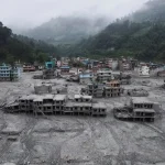 A drone view shows houses covered in mud after the flash floods and mudslide, at Devighat, Nuwakot district, Nepal, August 29, 2026. REUTERS/Francis Mascarenhas