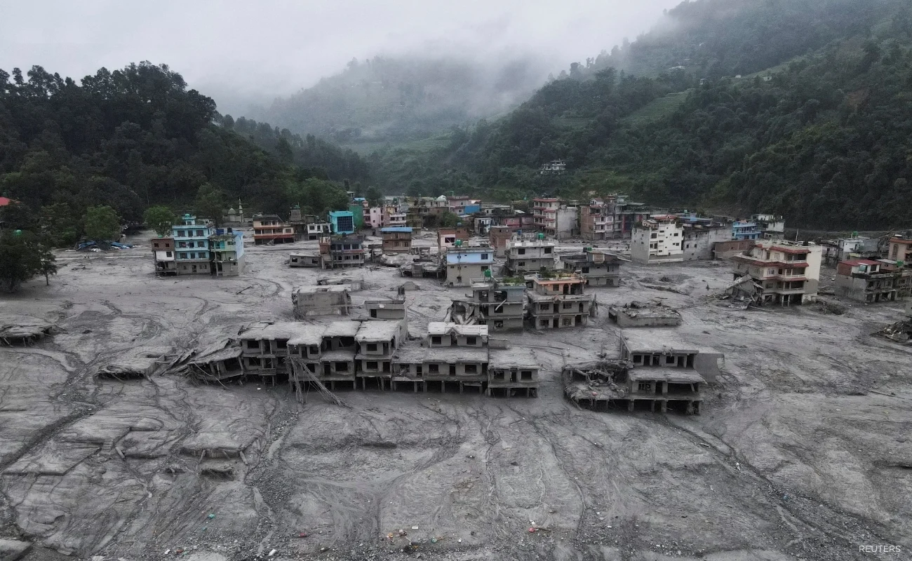 A drone view shows houses covered in mud after the flash floods and mudslide, at Devighat, Nuwakot district, Nepal, August 29, 2026. REUTERS/Francis Mascarenhas