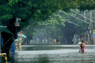 Heavy flooding submerged streets in Sta. Ana, Pampanga, forcing residents to wade through deep flood-waters on Aug. 31, Monday.