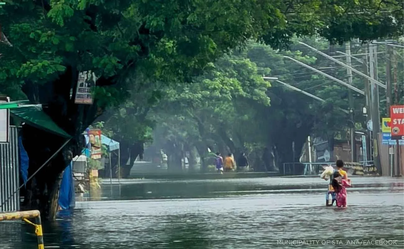 Heavy flooding submerged streets in Sta. Ana, Pampanga, forcing residents to wade through deep flood-waters on Aug. 31, Monday.