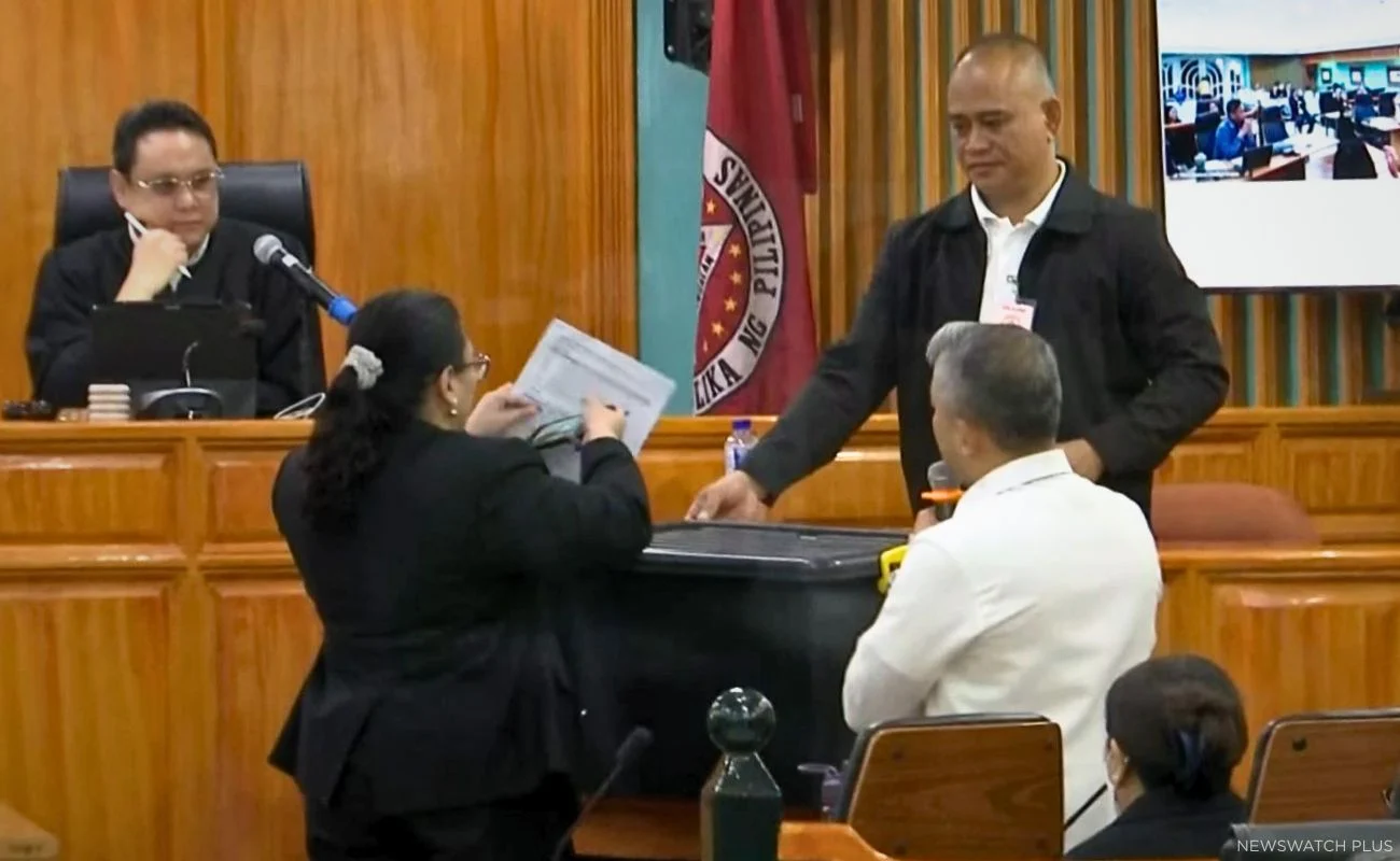 Self-confessed bagman Rodante Orbillo takes the witness stand as prosecutors present a black durabox allegedly used to transport kickbacks during the Oct. 15 bail hearing of former House Speaker Martin Romualdez.